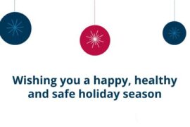 Three Christmas baubles on a white background. Blue text reads Wishing you a happy, healthy and safe holiday season.