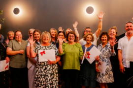 Award winners with hands up in air