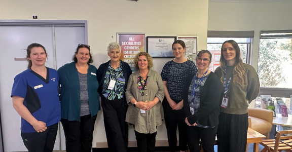 one student and six female midwives