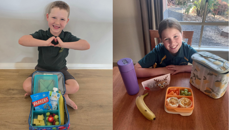 Group of people holding their award certificate frames