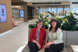Two midwifes sitting in a hospital café.