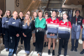 A group of people standing in the hospital foyer