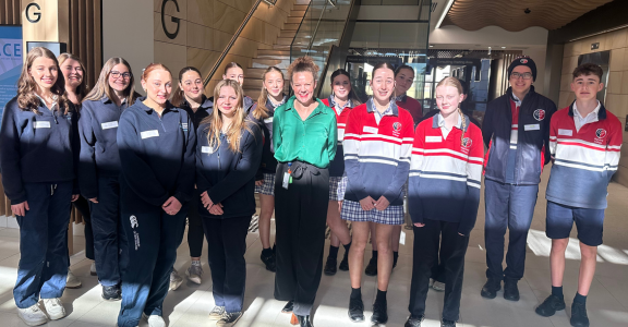 A group of people standing in the hospital foyer
