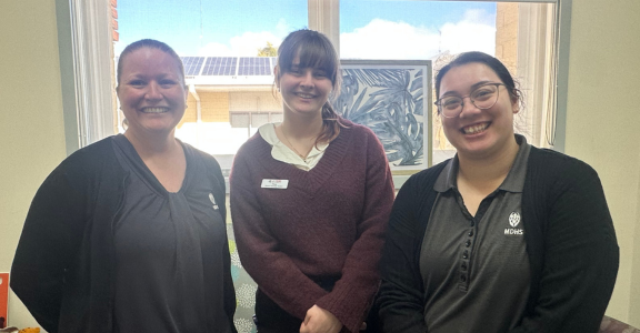 three people in MDHS uniforms and casuals