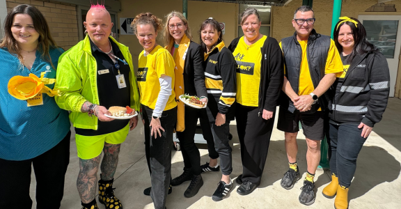 group of people wearing yellow.