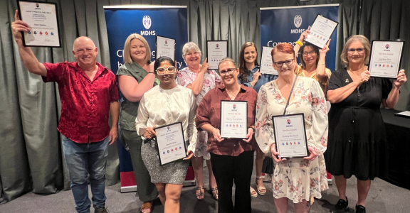 Group of people holding their certificate frames