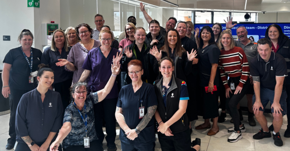 big group of MDHS team members celebrating accreditation